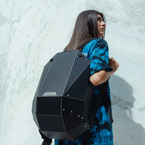 black hardshell backpack